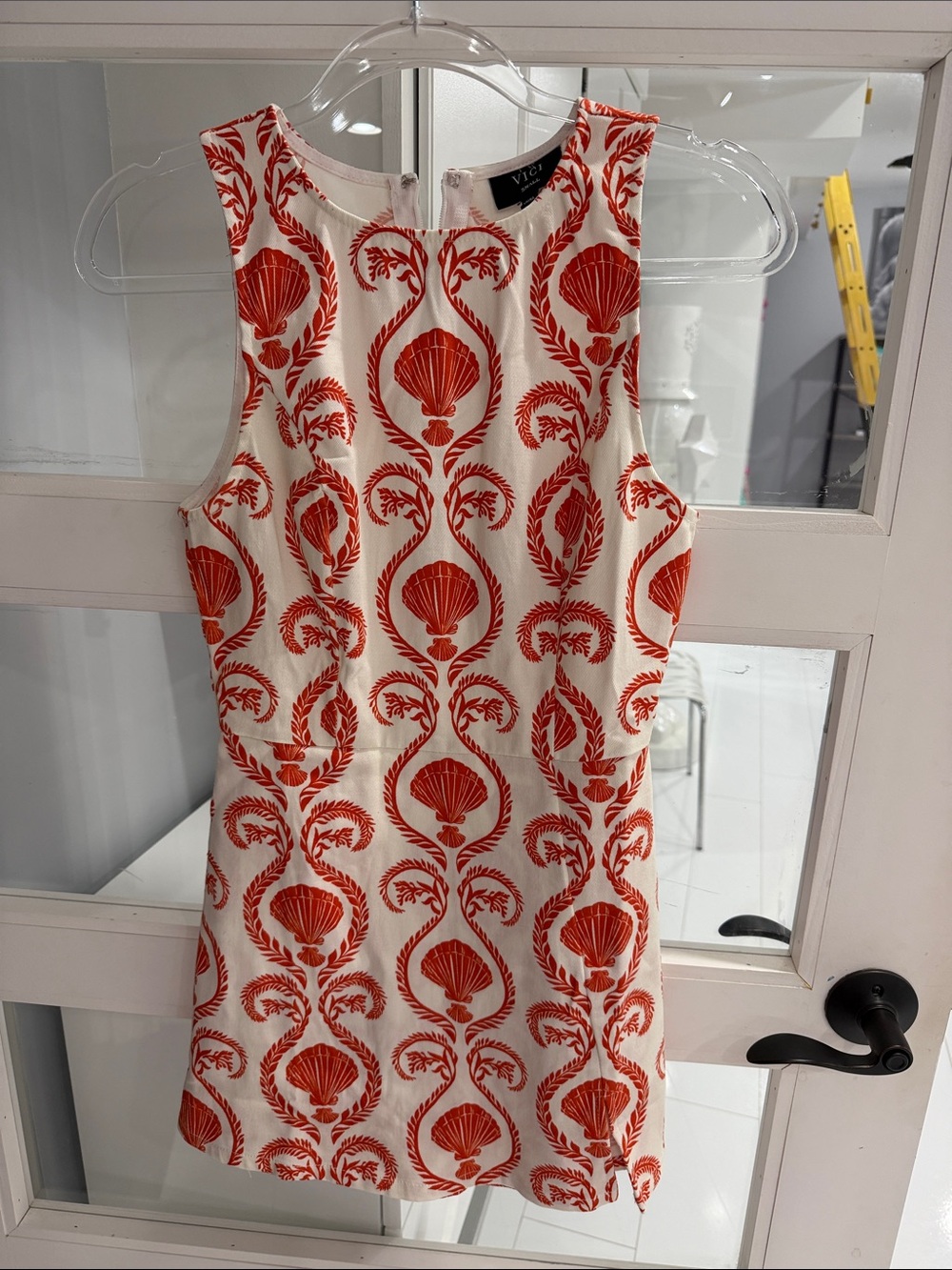 Vici White Sleeveless Romper with Red Shell Print